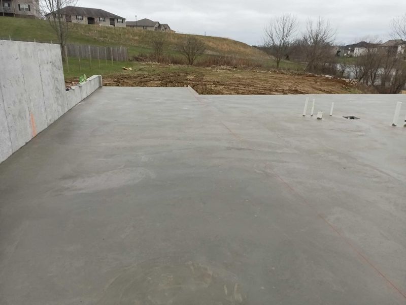 Poured basement floor slab inside a house