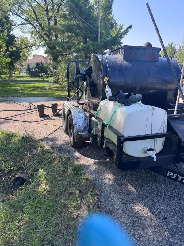 Revitalizing Forgotten Driveways: Black Diamond Sealcoating's Expertise in Transforming Rental Properties