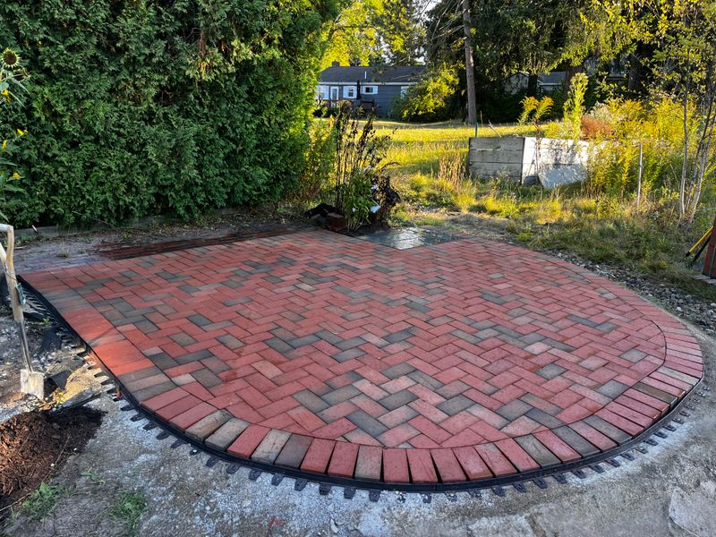 Elegant Herringbone Patio Transformation: Enhancing Outdoor Living with Dakine Masonry