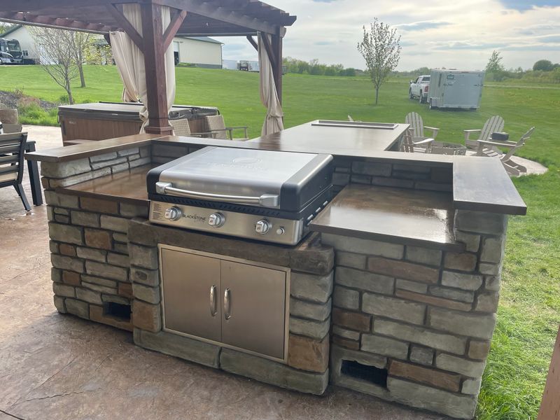 Outdoor kitchen and living spaces.