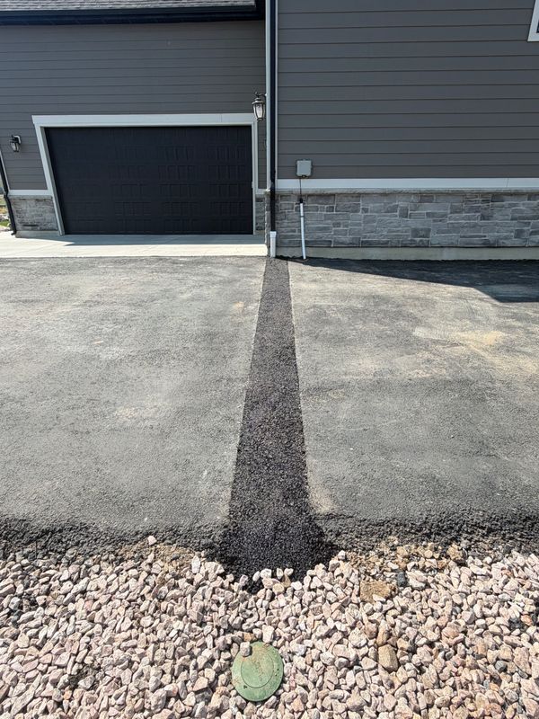 Roof Runoff Was Turning This Driveway Into a Winter Ice Patch