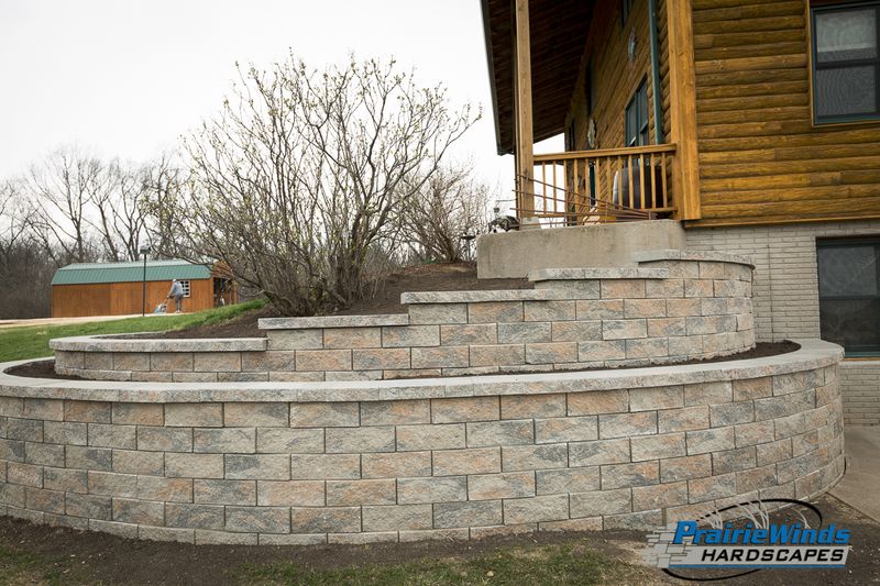 Elevating Excellence: Stunning Tiered Retaining Wall Transformation by Prairie Winds Hardscapes