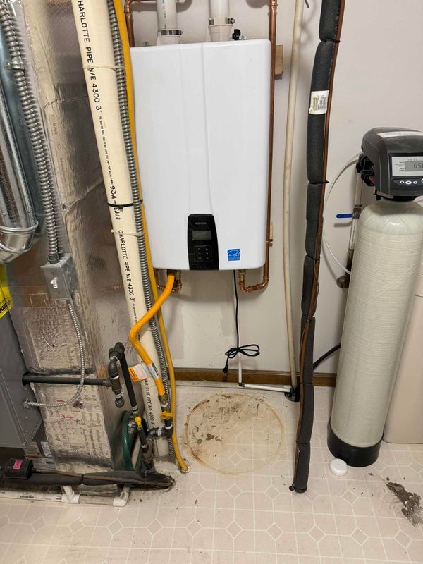 Innovative Water Solutions: Tankless Climate Control and Enhanced Sump Pump System in Bargersville