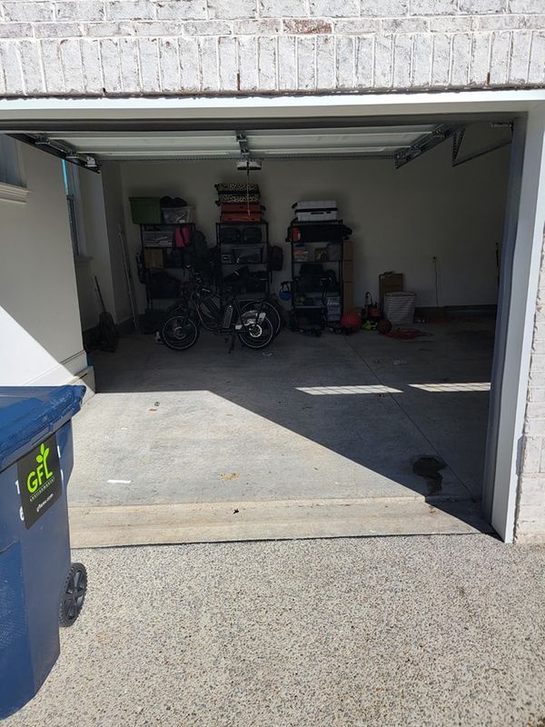 The same garage cleared out and swept after the cleanout