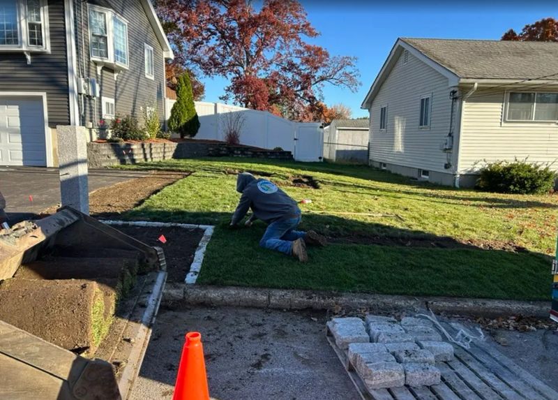 Transformative Front Yard Renovation: Expert Grading, Lush Sod & Elegant Hardscape by Martin's Landscaping & Construction