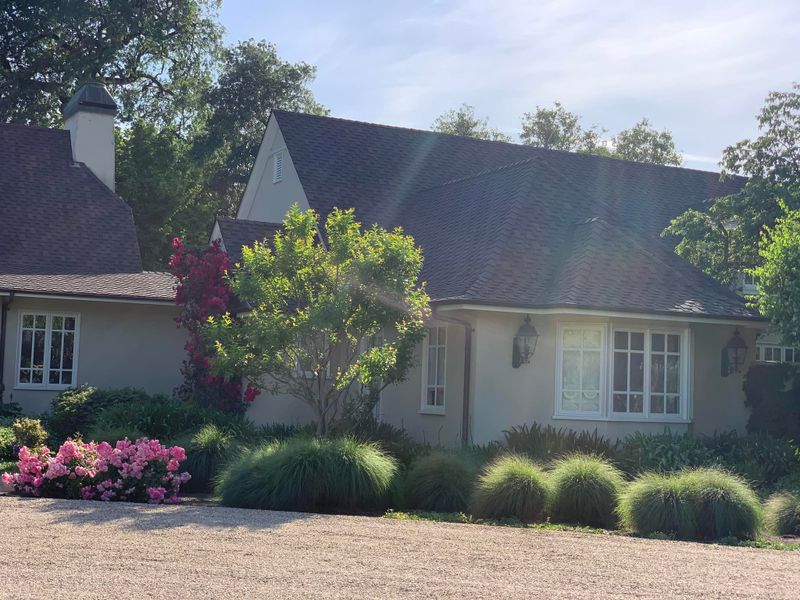 Home with a hipped roof and dormers, roof by Art's Roofing Inc