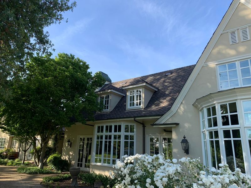 Home with dormer windows and a new roof, roof by Art's Roofing Inc