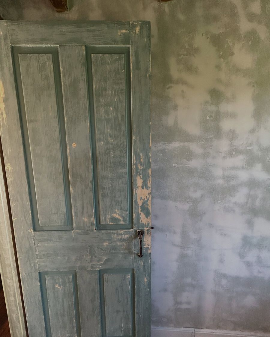 Original paneled door being prepared for paint
