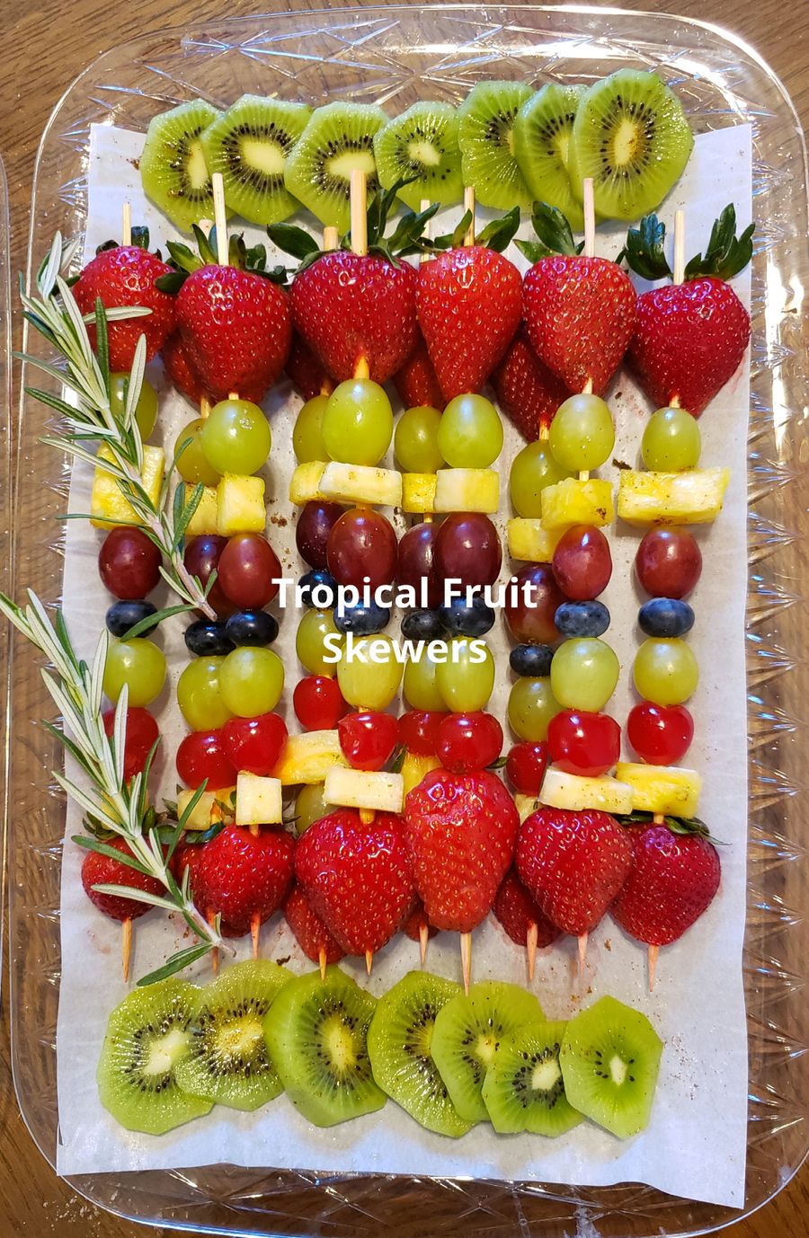 Tropical fruit skewers with kiwi, strawberries and grapes