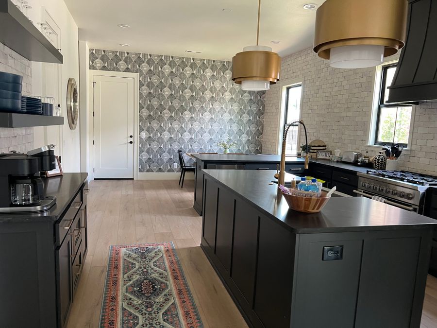 Black kitchen island and range after a clean