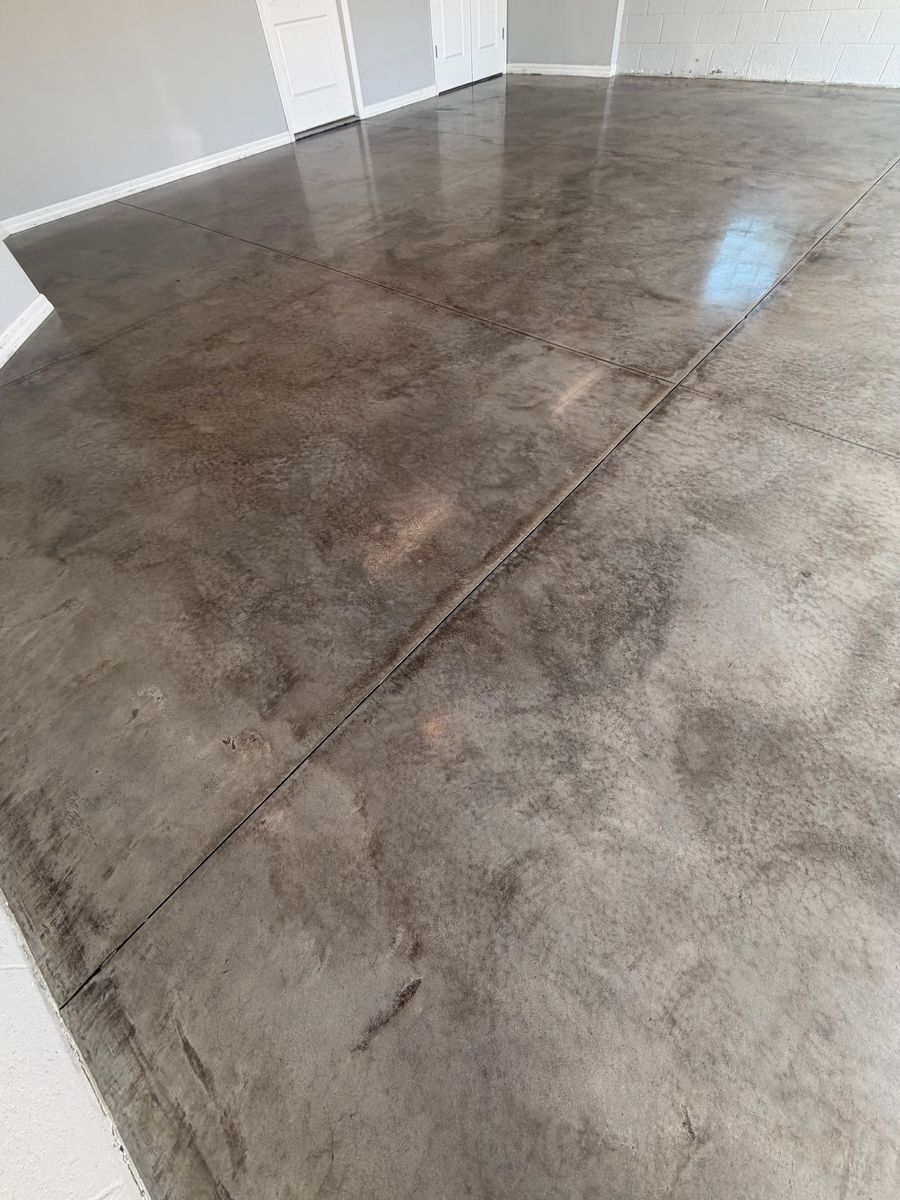 Gray and brown stained concrete floor in a bright room