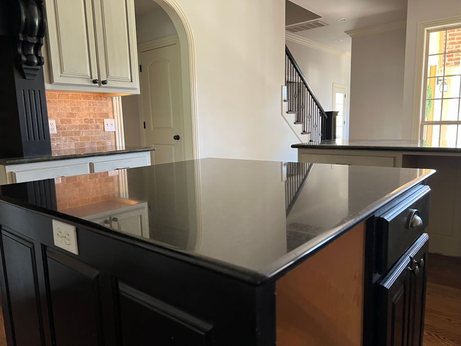 Black granite kitchen island polished clean