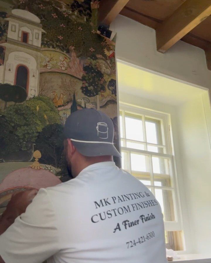 Mitch Killeen of MK Painting at a farmhouse window in Montgomery County