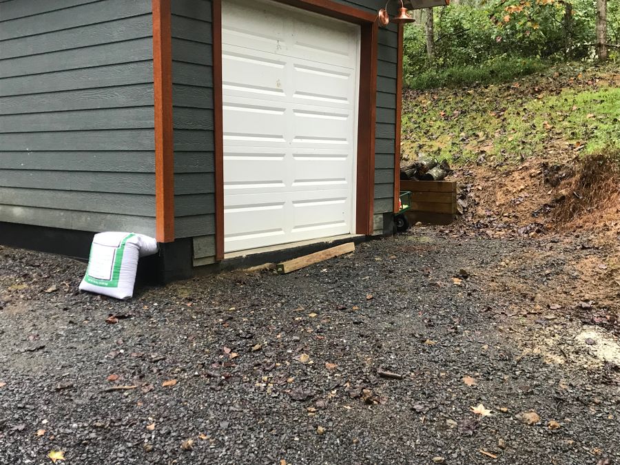 Gravel pad at a garage door