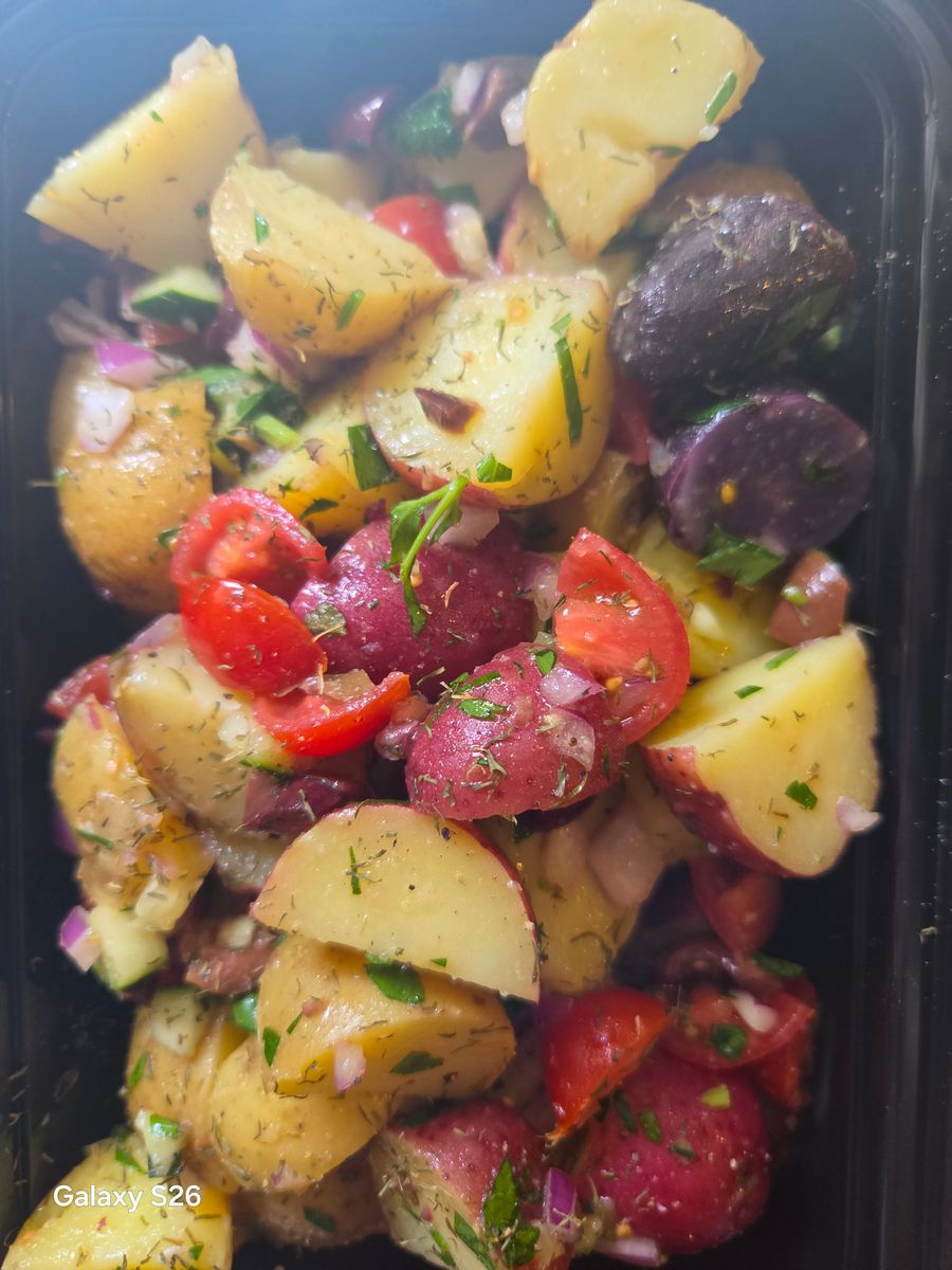 Potato salad with tomatoes and herbs