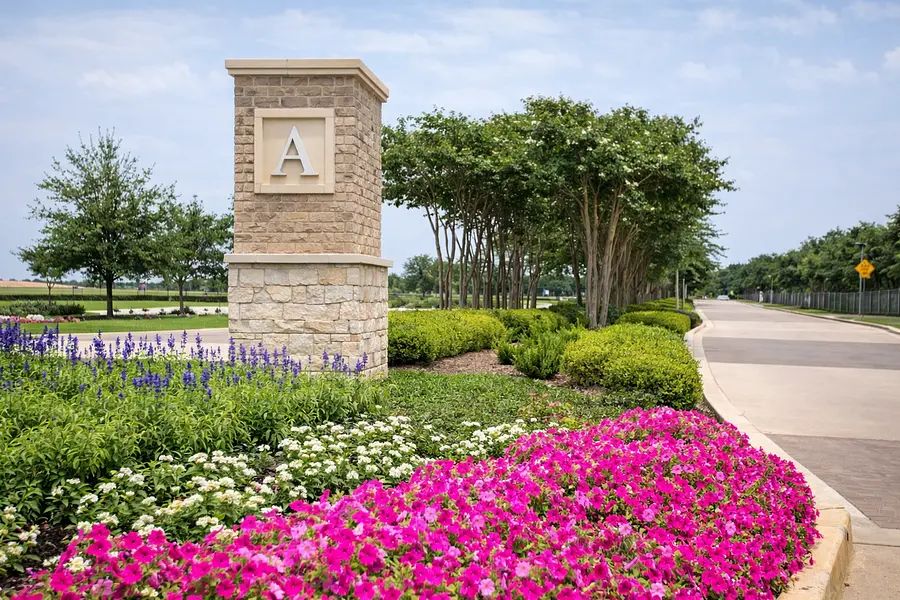 Seasonal color planted at a community entry monument