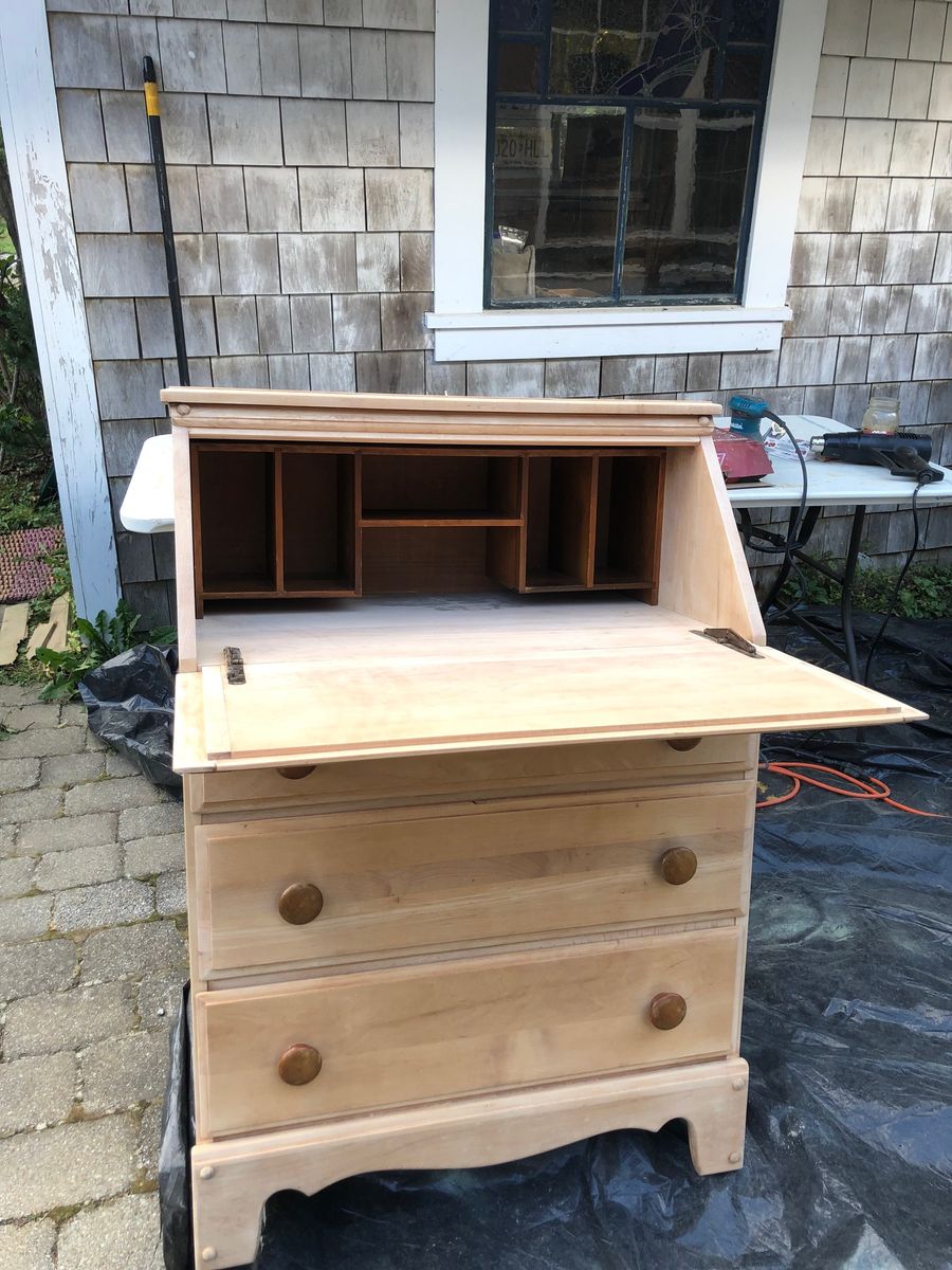 Old secretary desk stripped and refinished, open to show its cubbies