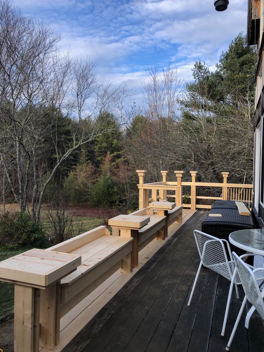 Built-in cedar benches along the edge of a deck