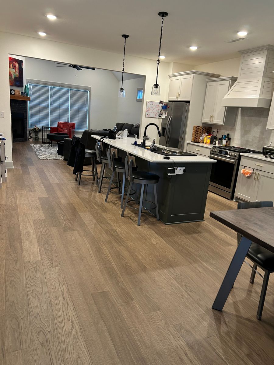 Open kitchen and living area after a move-in clean