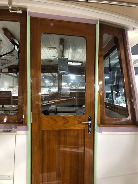 Varnished teak and mahogany cabin door on a boat