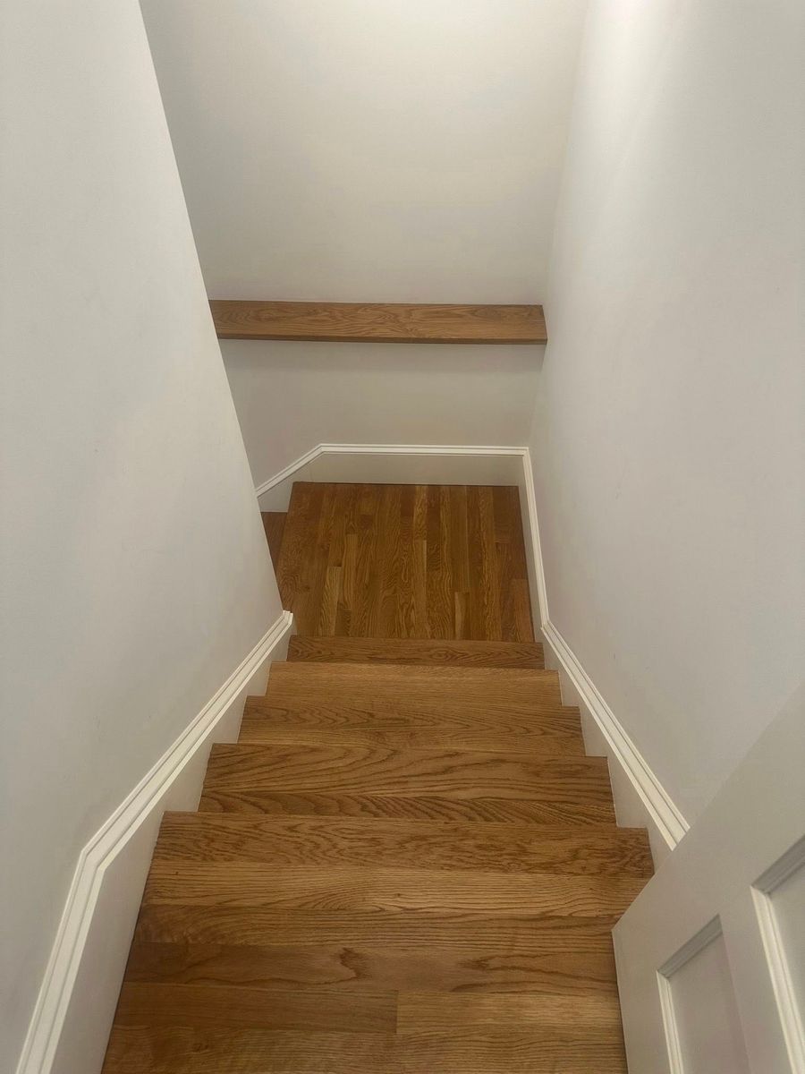 Painted stairwell with stained treads