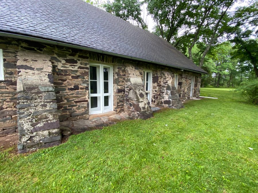 Small stone cottage with white painted windows