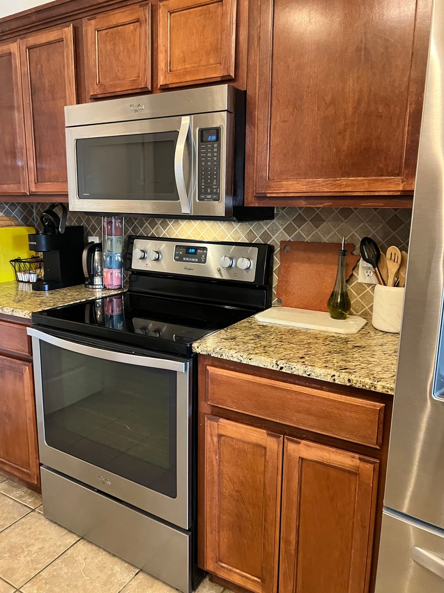 Kitchen with stainless appliances after a clean