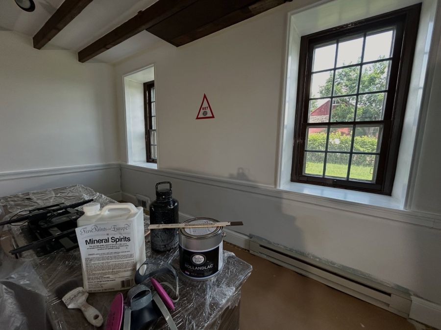 Farmhouse room mid-preparation with primers and plastic