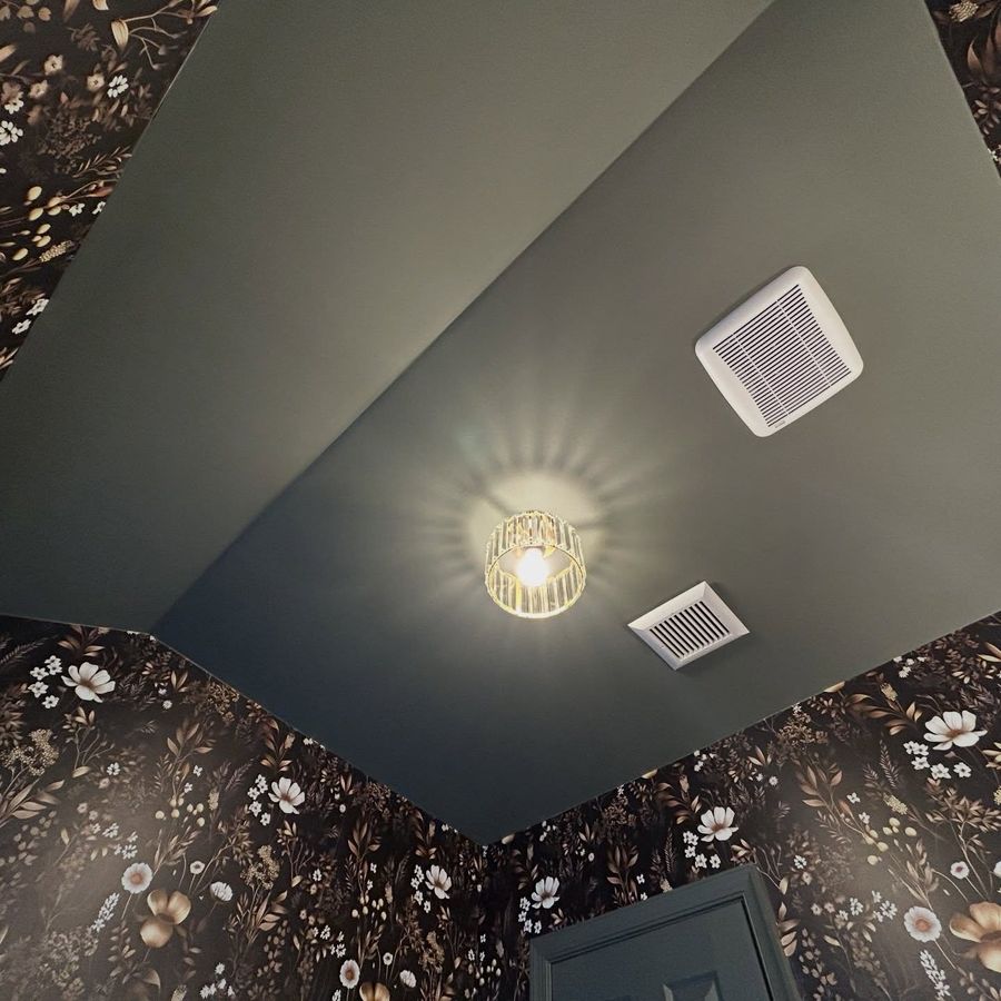 Floral wallpaper meeting a painted ceiling