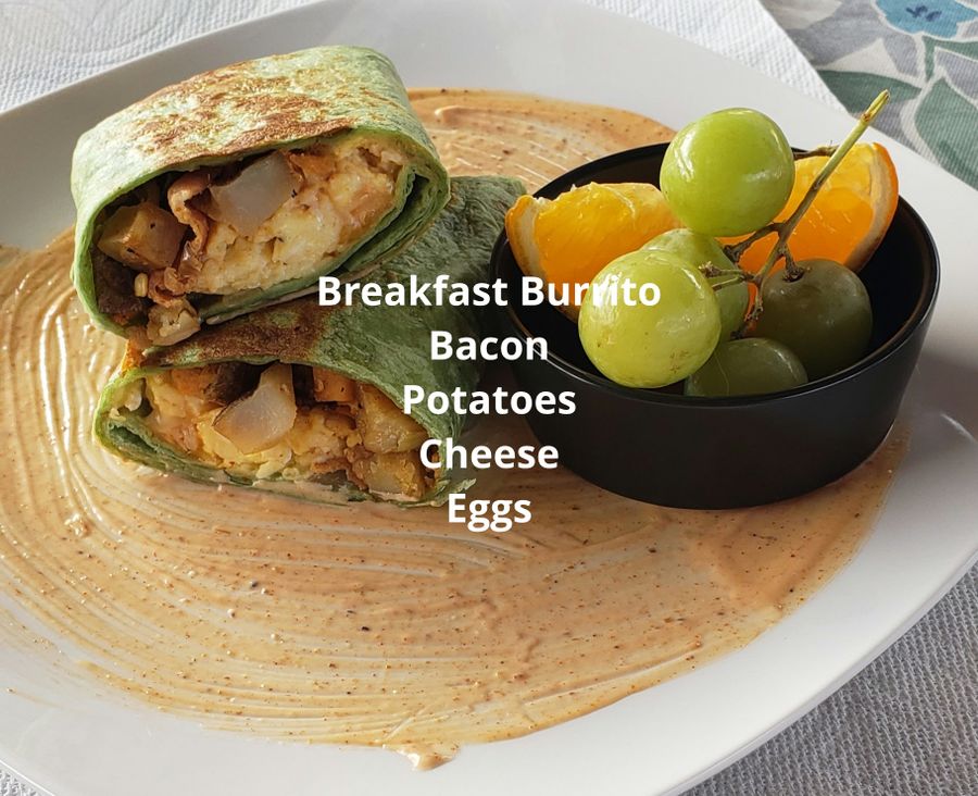 Breakfast burrito with bacon, potatoes, cheese and eggs