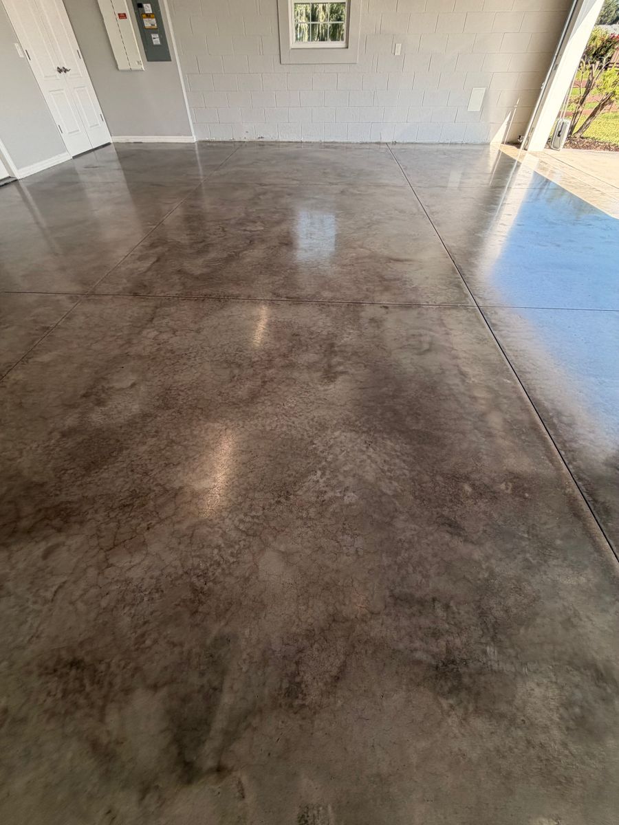 Glossy stained concrete floor with saw-cut joints