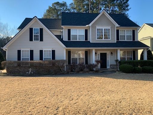 Two-story home with a new black roof