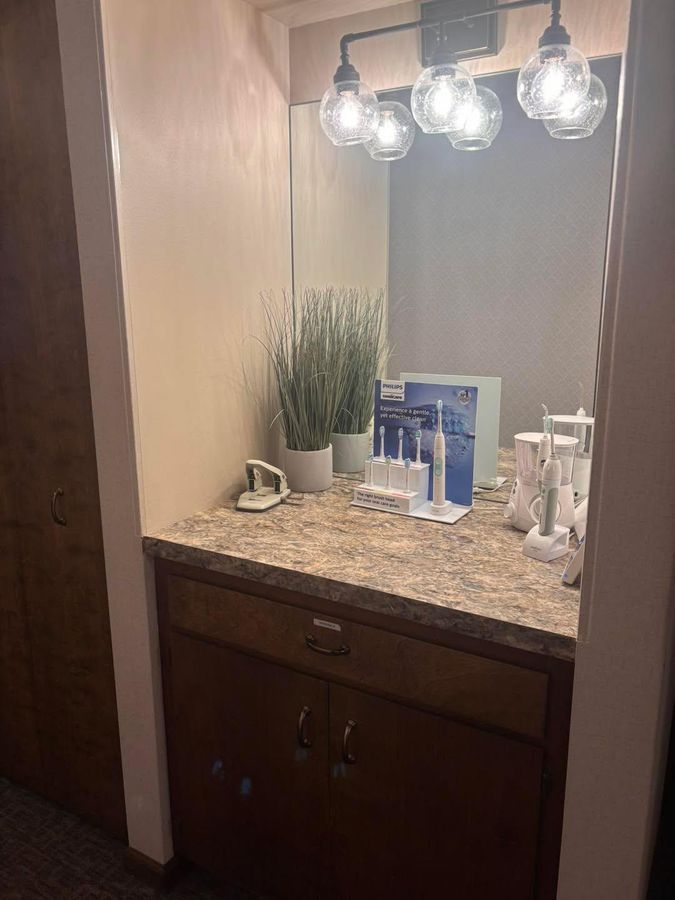 Clean bathroom vanity and mirror after a post-construction cleaning