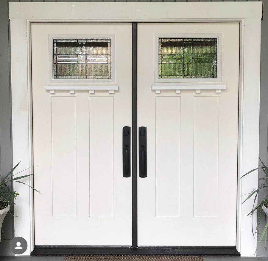 White double entry doors with leaded glass inserts after installation