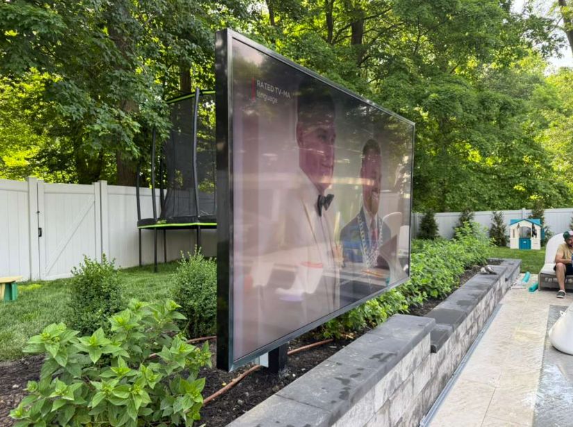 TV installation with surround sound speakers
