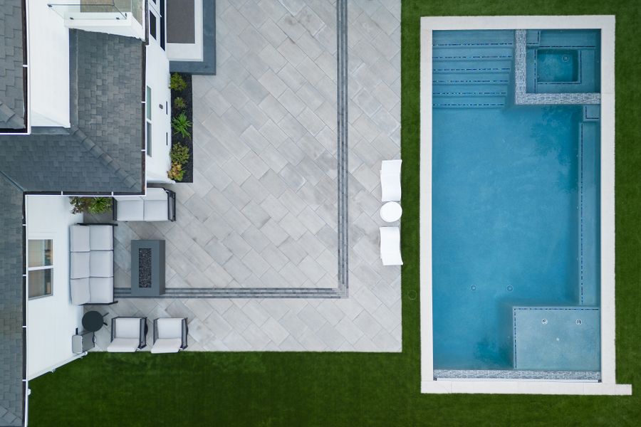 Overhead aerial of the finished garden, pool and terrace laid out against the turf