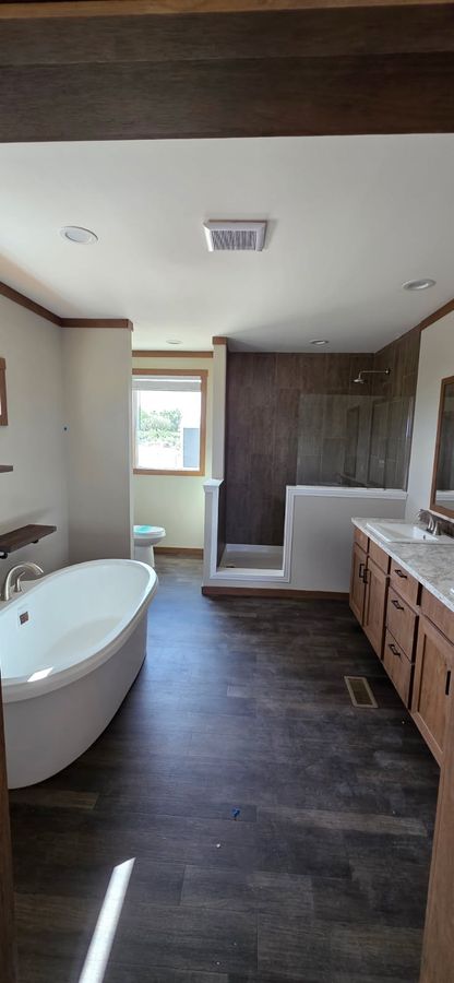 Finished bathroom with a freestanding tub and fresh paint