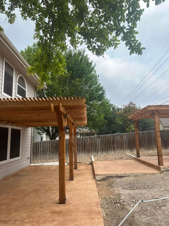 Stamped concrete patio under a new wood pergola