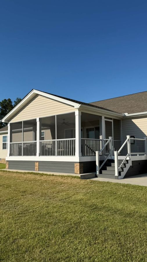 New screened porch addition on the back of a home