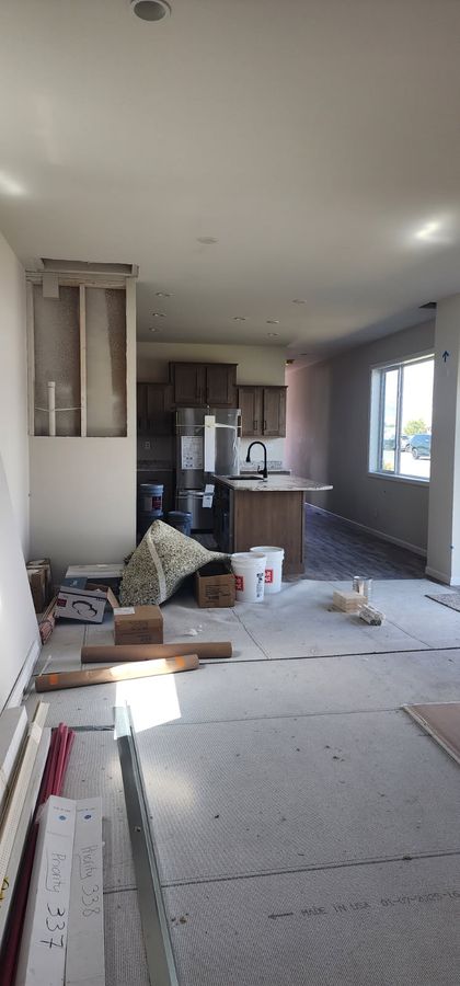 Kitchen remodel in progress with new drywall