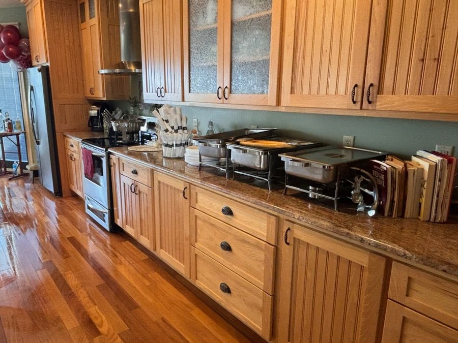 Long wood kitchen cabinets and clean counters after a deep cleaning