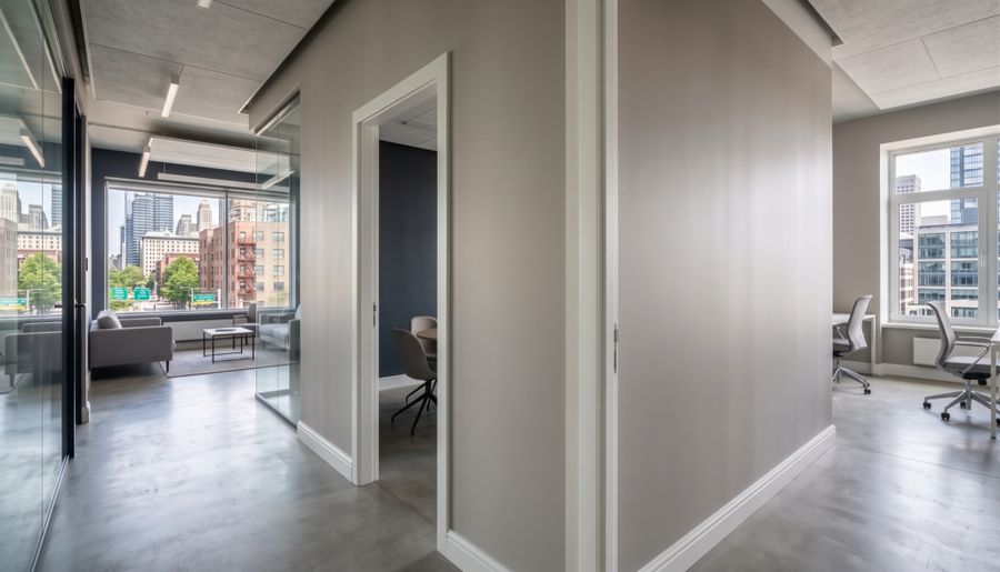Bright interior with gray walls, glass doors and new flooring