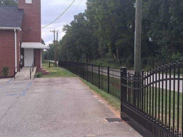 Black aluminum arched driveway gate