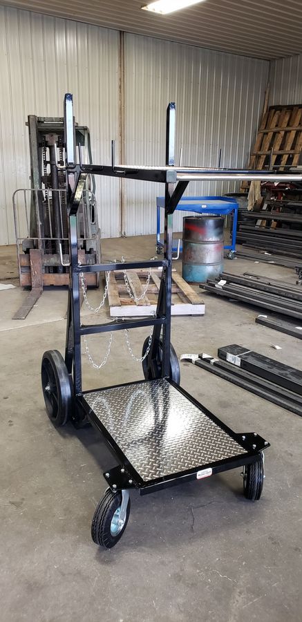 Fabricated black steel shop cart standing on a shop floor