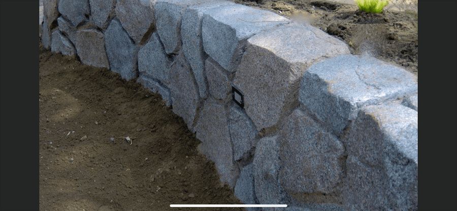 Curved stone-look retaining wall