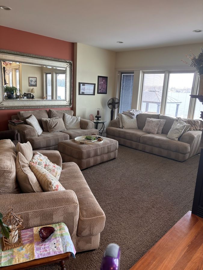 Freshly cleaned open living area with wood floors ready for move in