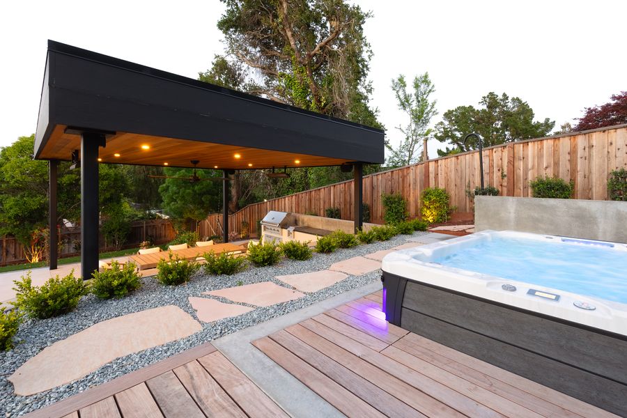 Swim spa set into a composite deck beneath a second pavilion