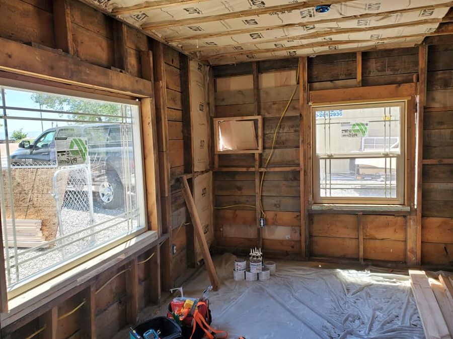 Gutted room down to the studs with new windows, before drywall is hung