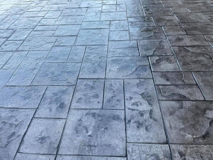 Close view of a gray stamped slate pattern with tooled joints