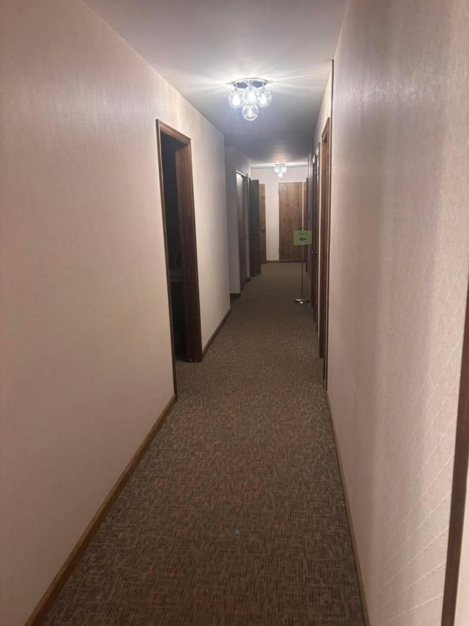 Long clean office hallway with freshly washed walls